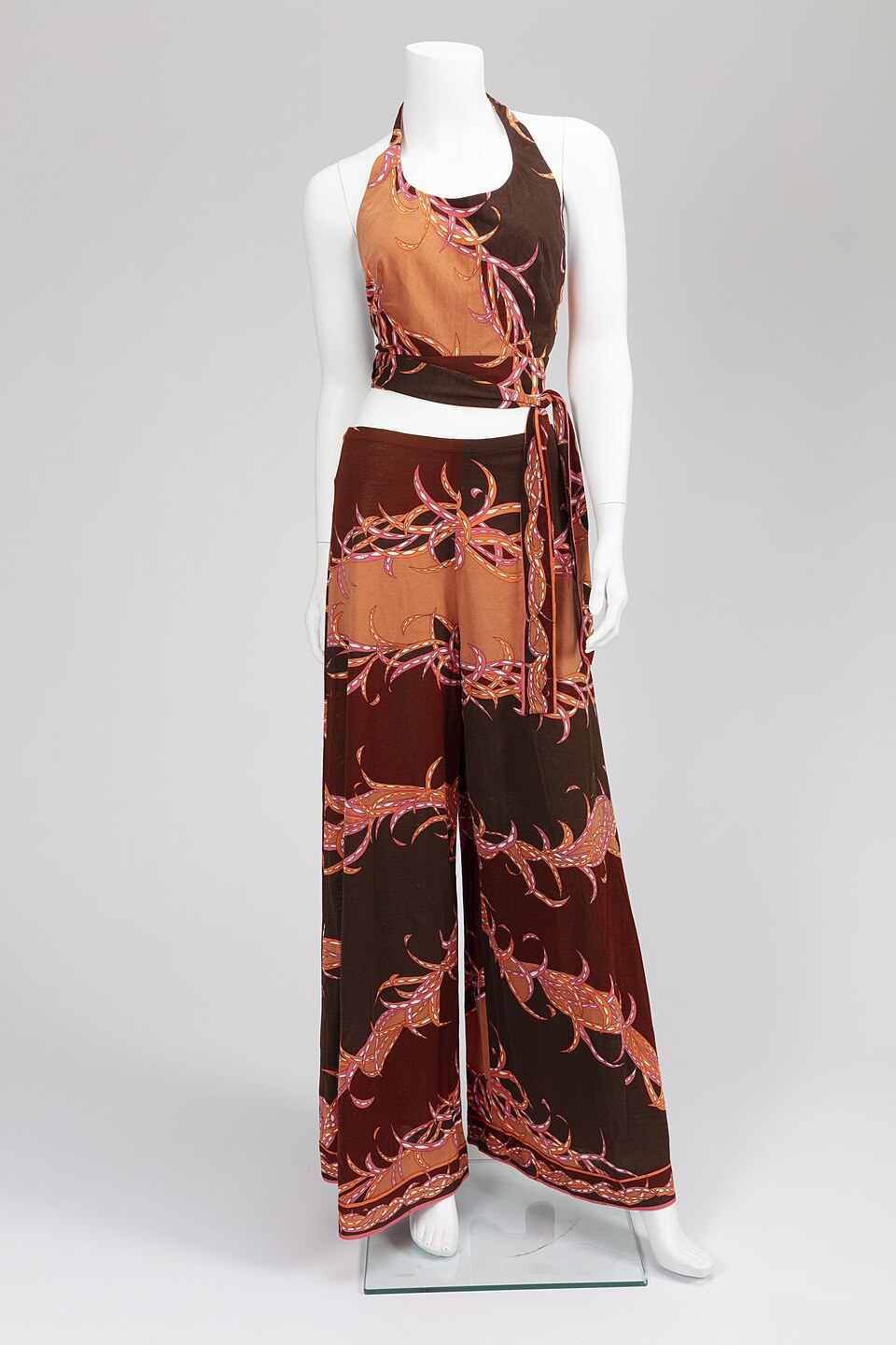 Woman's printed jersey halter top and pants designed by Emilio Pucci.